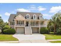 Charming two-story home features a double front porch, manicured lawn, and driveway at 3526 Stockton Dr, Mount Pleasant, SC 29466