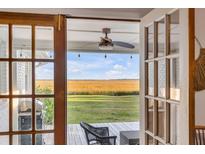 Charming view from the deck showcasing marshland and big skies at 561 Seaward Dr, Charleston, SC 29412