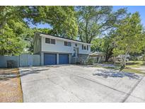 Charming two-story home features a two-car garage and a spacious concrete driveway at 14 Newark Ave, Goose Creek, SC 29445