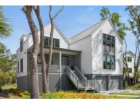 Beautiful two-story home with a modern design and inviting front porch at 2138 Boatwright Rd, Johns Island, SC 29455