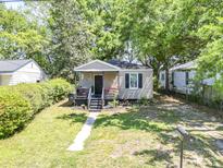 Charming single-story home featuring a cozy front porch and well-maintained lawn at 2125 Victory Ave, North Charleston, SC 29405