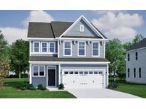 Charming two-story home features a classic design and a pristine white garage door at 555 O'Leary Cir, Summerville, SC 29483