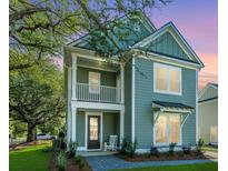 Charming two-story home with a welcoming front porch and a small balcony on the second floor at 101 Pine Waters Ln, Summerville, SC 29483