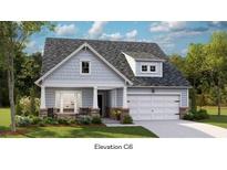 Charming home featuring shingle accents, manicured lawn, covered porch, and a two-car garage at 1040 T Tulip Shell St, Summerville, SC 29485