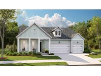 Charming single-story home featuring a two-car garage and well-manicured landscaping and covered entry at 1124 Darling St, Summerville, SC 29485