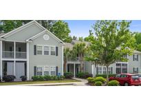 Exterior of a lovely condo building, with well-maintained landscaping and ample parking at 308 Pickering Ln, Charleston, SC 29414