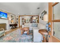 Inviting living room features a comfortable sectional sofa and warm, inviting decor, perfect for relaxing and entertaining guests at 356 Hobcaw Dr, Mount Pleasant, SC 29464