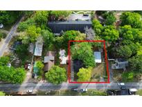 Aerial view of a property in a neighborhood with mature trees and adjacent houses at 4232 Grimke St, North Charleston, SC 29405