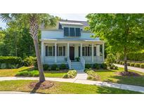 Charming two-story home with a welcoming front porch, landscaped yard and lovely curb appeal at 1510 Windlass Way, Mount Pleasant, SC 29466