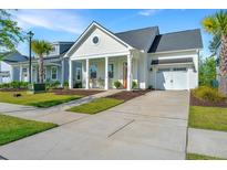 Charming single-Gathering home with a welcoming front porch and manicured lawn at 1521 Pogonia St # 4, Mount Pleasant, SC 29464