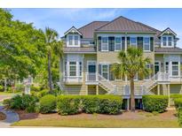 Charming townhome featuring a private entrance, well-manicured landscaping, and a light, neutral color palette at 1650 Long Grove Dr, Mount Pleasant, SC 29464