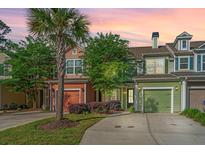 Charming townhomes with colorful exteriors, attached garages, and well-maintained landscaping at 1823 Chauncys Ct, Mount Pleasant, SC 29466