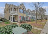 Charming townhomes feature front porches, upper balconies, and well-maintained landscaping at 2096 Promenade Ct, Mount Pleasant, SC 29466