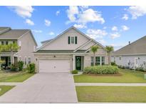Charming home featuring a brick facade, attached garage, palm trees, and a well-manicured front yard at 523 Fern Tree Dr, Summerville, SC 29486