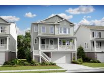 Charming two-story home featuring a garage and inviting front porch with white railing and a well-manicured lawn at 1664 Siloh St # 471, Mount Pleasant, SC 29466