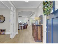 Inviting entryway with hardwood floors and open layout to the living room at 3154 Hugh Bennett Dr, Johns Island, SC 29455