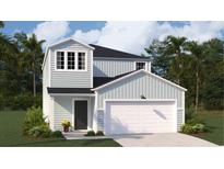 Charming two-story home with a light blue exterior, two-car garage, and a neatly landscaped front yard at 325 Pine Crest View, Summerville, SC 29486