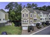 Charming townhome with two-car garage, brick driveway, and lush landscaping at 5911 Steward St # 24, Hanahan, SC 29410