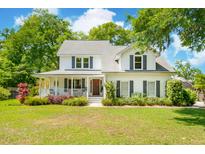 Charming two-story home with a welcoming front porch and beautifully landscaped front yard at 679 Clearview Dr, Charleston, SC 29412