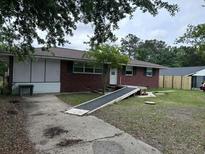 Charming single-story brick house with a ramp leading to the front door at 10 Cranford Rd, Goose Creek, SC 29445
