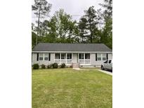 Charming ranch-style home with a well-maintained front lawn and inviting curb appeal at 110 Kay St, Ridgeville, SC 29472