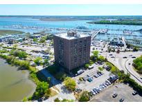 Stunning aerial view of a high-rise building near the marina, showcasing its prime waterfront location and nearby amenities at 14 Lockwood Dr # 9K, Charleston, SC 29401