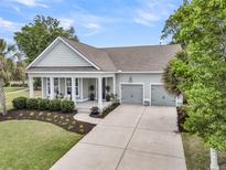 Charming single-story home with a manicured front yard and a two-car garage at 1472 Longspur Dr, Mount Pleasant, SC 29466