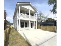 Charming two-story home with a double porch, modern gray siding, and spacious concrete driveway at 2508 Corona St, North Charleston, SC 29405