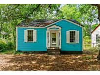 Charming blue house featuring white trim, shuttered windows and a quaint front porch at 2654 Harvey Ave, North Charleston, SC 29405