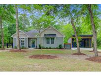 Charming single-story home featuring a welcoming entrance and well-maintained landscaping at 3360 Fickling Hill Rd, Johns Island, SC 29455