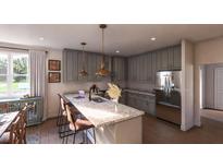 Modern kitchen with stainless steel appliances, pendant lighting, and a large center island with bar seating at 401 Oak Hammock Ct # 48, Johns Island, SC 29455