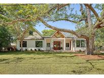Beautiful craftsman home featuring a landscaped front yard, white siding, and a welcoming entryway at 422 Palm St, Mount Pleasant, SC 29464