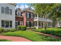 Charming two-story brick home with double porches, black shutters, and professionally landscaped yard at 1781 Tennyson # 6, Mount Pleasant, SC 29466