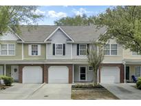 Charming townhomes feature attached garages and professionally landscaped yards at 522 Tayrn Dr, Wando, SC 29492