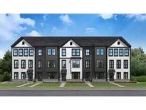 Modern townhome exterior featuring a black roof and contrasting black and white color scheme at 566 Scholar Way, Summerville, SC 29486