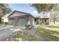 Charming brick home with an attached two-car garage and well-maintained lawn at 804 Temple Rd # B, Ladson, SC 29456