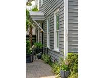 Charming exterior detail of the home's architecture and landscaping at 104 May Ln, Mount Pleasant, SC 29464