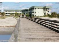 Charming condos with balconies, beach access via boardwalk, and lush landscaping at 1300 Ocean Blvd # 308, Isle of Palms, SC 29451