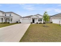 Charming single-story home featuring a well-manicured lawn and attached garage in a residential neighborhood at 292 Shadybrook Dr, Summerville, SC 29486