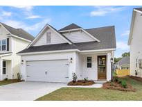 Charming single Gathering home featuring a 1-car garage and a well-maintained lawn at 417 Grove End Rd, Moncks Corner, SC 29461