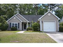 Charming single-story home features a one-car garage and well-maintained landscaping in a tree-lined neighborhood at 5276 Copley Cir, Summerville, SC 29485