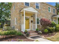 Charming two-story home with yellow brick exterior, covered porch, and beautifully landscaped front yard at 7 Chadwick Dr # A, Charleston, SC 29407