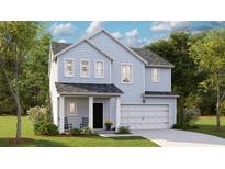 Charming two-story home with light blue siding and a welcoming front porch at 1023 Swamp Rose Run, Summerville, SC 29485