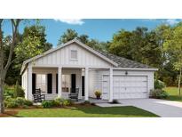 Charming single-story home with a covered front porch, two rocking chairs, and a one car garage at 1032 Scotch Bonnet Way, Summerville, SC 29485