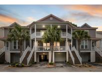 Charming gray townhouse with double balconies, stairs, and palm trees in front at 3019 Fraserburgh Way, Mount Pleasant, SC 29466