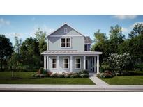 Charming two-story home featuring a welcoming front porch and beautiful landscaping at 778 Clay Field Trl, Summerville, SC 29485
