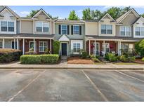 Townhouse exterior featuring well-maintained landscaping, brick accents, and a private entrance at 122 Hornby Cir, Goose Creek, SC 29445