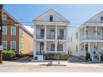 Charming two-story home with white brick facade and inviting front porch at 272 Coming St # C, Charleston, SC 29403