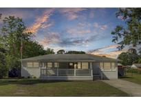 Charming single-story home with a welcoming front porch and well-maintained lawn at 32 Elmora Ave, Goose Creek, SC 29445