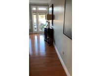 Inviting hallway with warm hardwood floors and stylish decor at 330 Concord St # Th17, Charleston, SC 29401